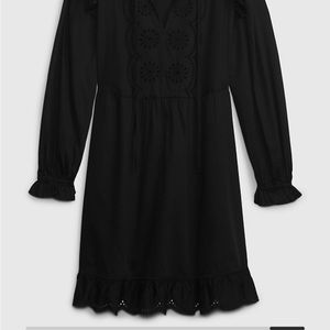 Brand new with tags black GAP dress with ruffle and eyelet trim. Size medium.